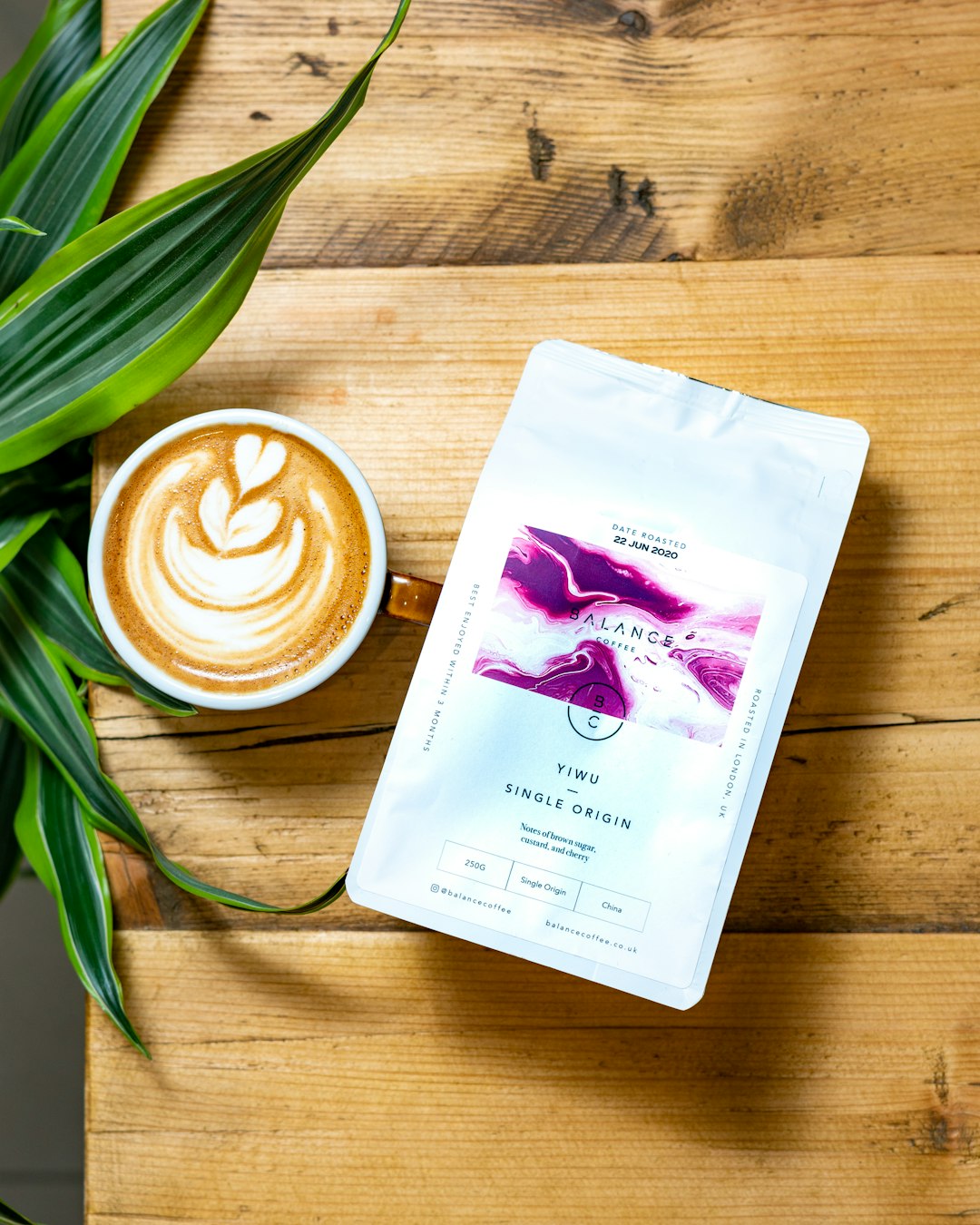 white-and-purple-plastic-pack-on-brown-wooden-table-bmpf-nevq8